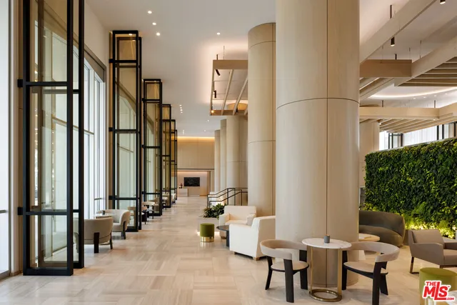 a view of a lobby with furniture and floor to ceiling window