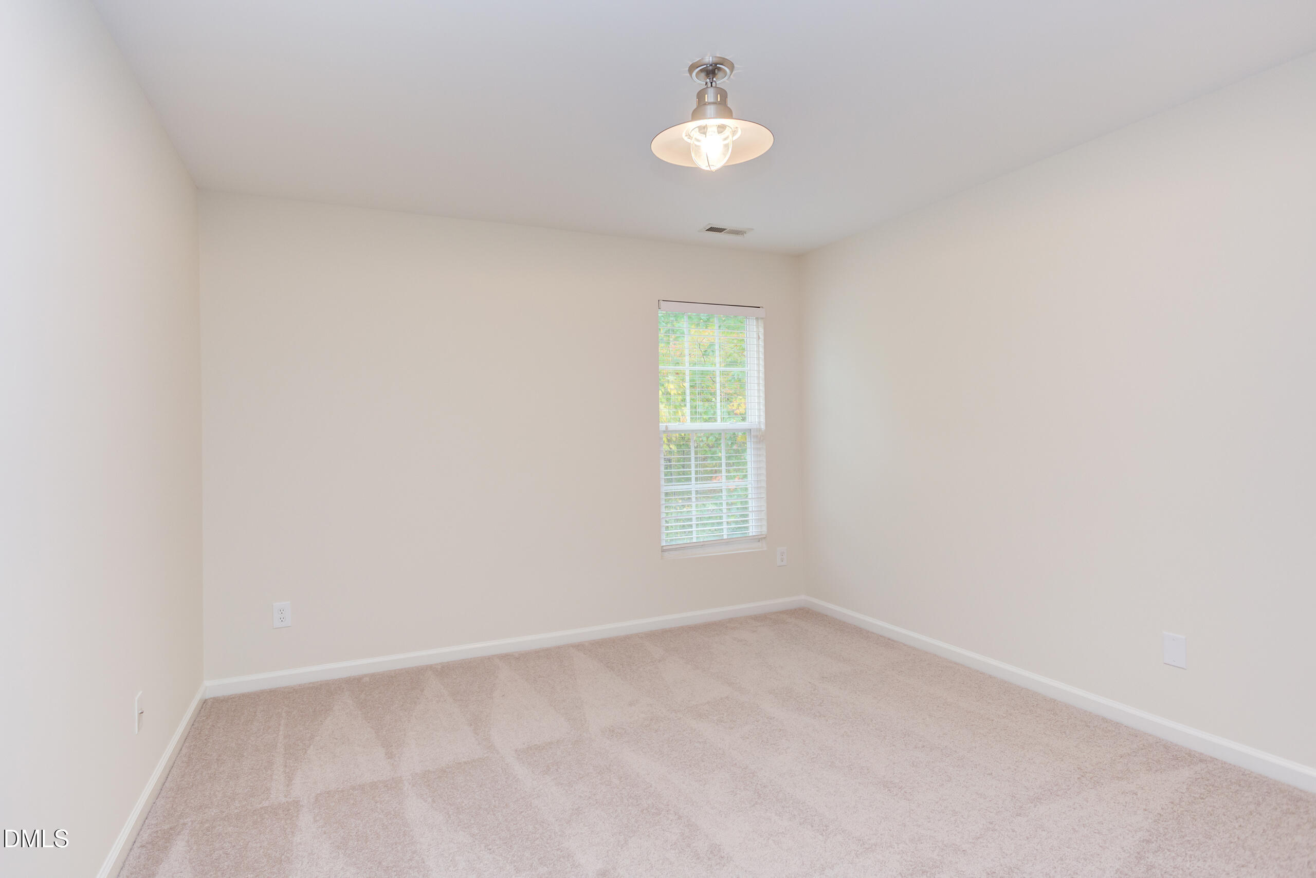 5620 Berry Creek Circle Raleigh, NC 27613 - Photo 27 of 38 an empty room with a window