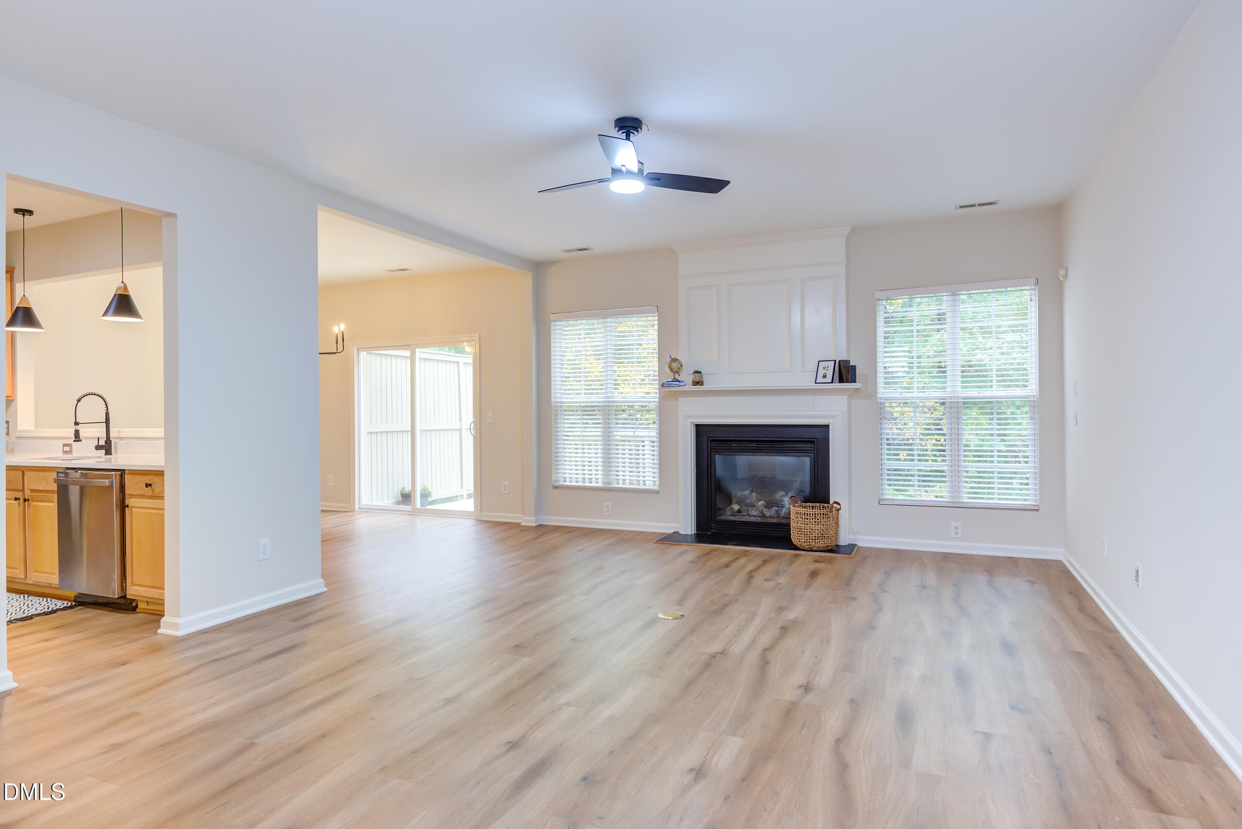 5620 Berry Creek Circle Raleigh, NC 27613 - Photo 6 of 38 a view of an empty room with wooden floor fireplace and a window
