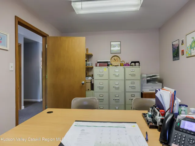 a bedroom with a bed and cabinets