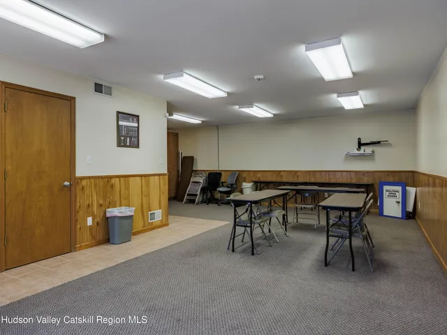 a patio with table and chairs