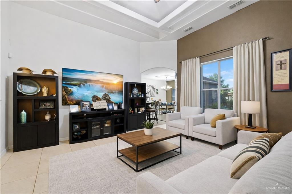 1721 West Ignacio Avenue Mission, TX 78573 - Photo 2 of 9 a living room with furniture and a flat screen tv