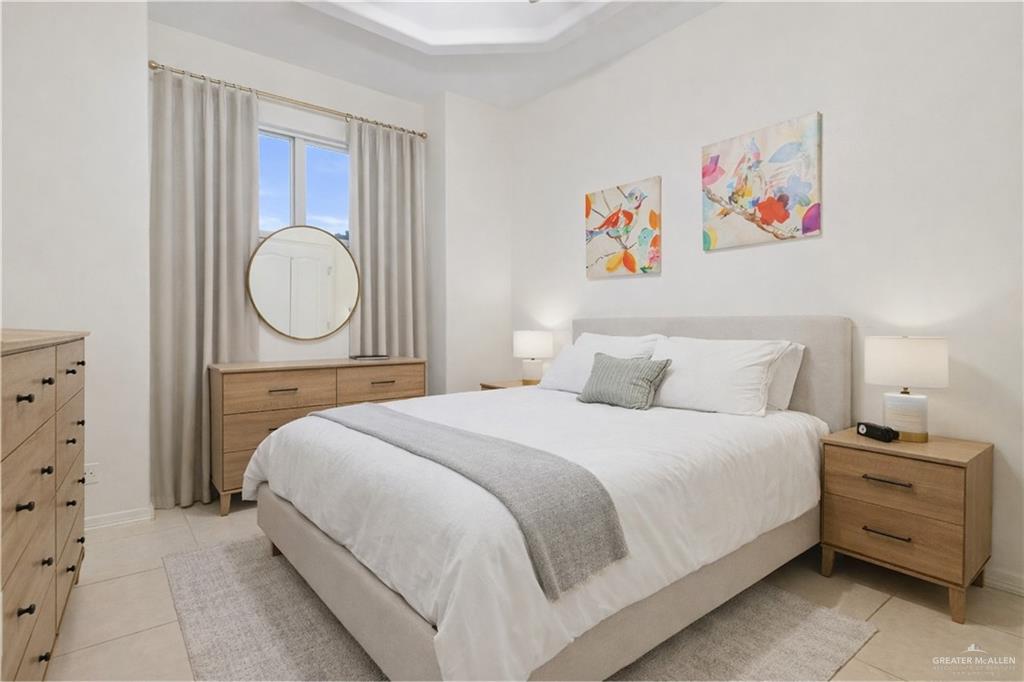 1721 West Ignacio Avenue Mission, TX 78573 - Photo 5 of 9 a bedroom with a bed and cabinet