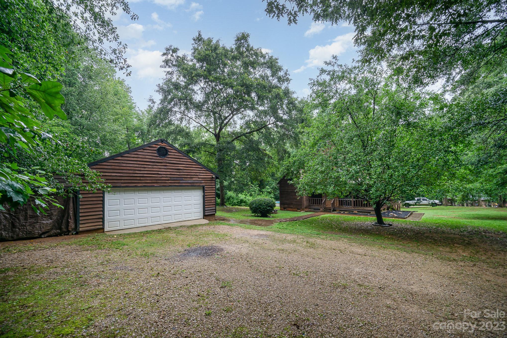 427 Laurel Hills Road Indian Land, SC 29707 - Photo 29 of 32 a view of a backyard with large trees