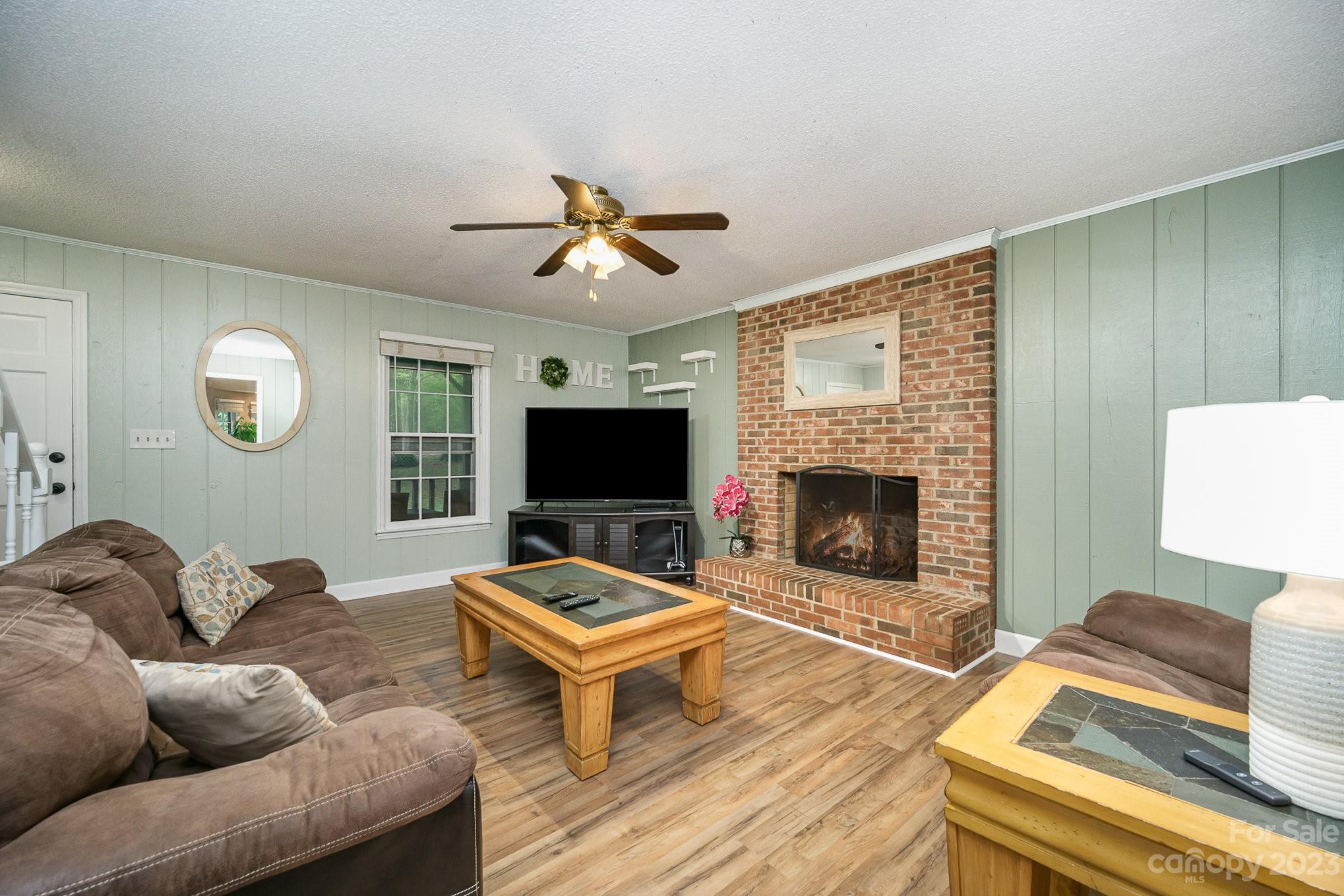 427 Laurel Hills Road Indian Land, SC 29707 - Photo 3 of 32 a living room with furniture and a fireplace
