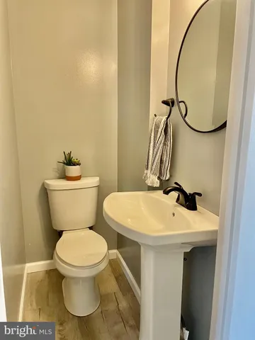 a bathroom with a sink and mirror