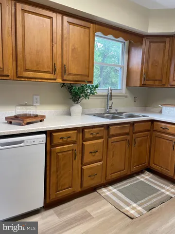 a stove top oven sitting inside of a kitchen