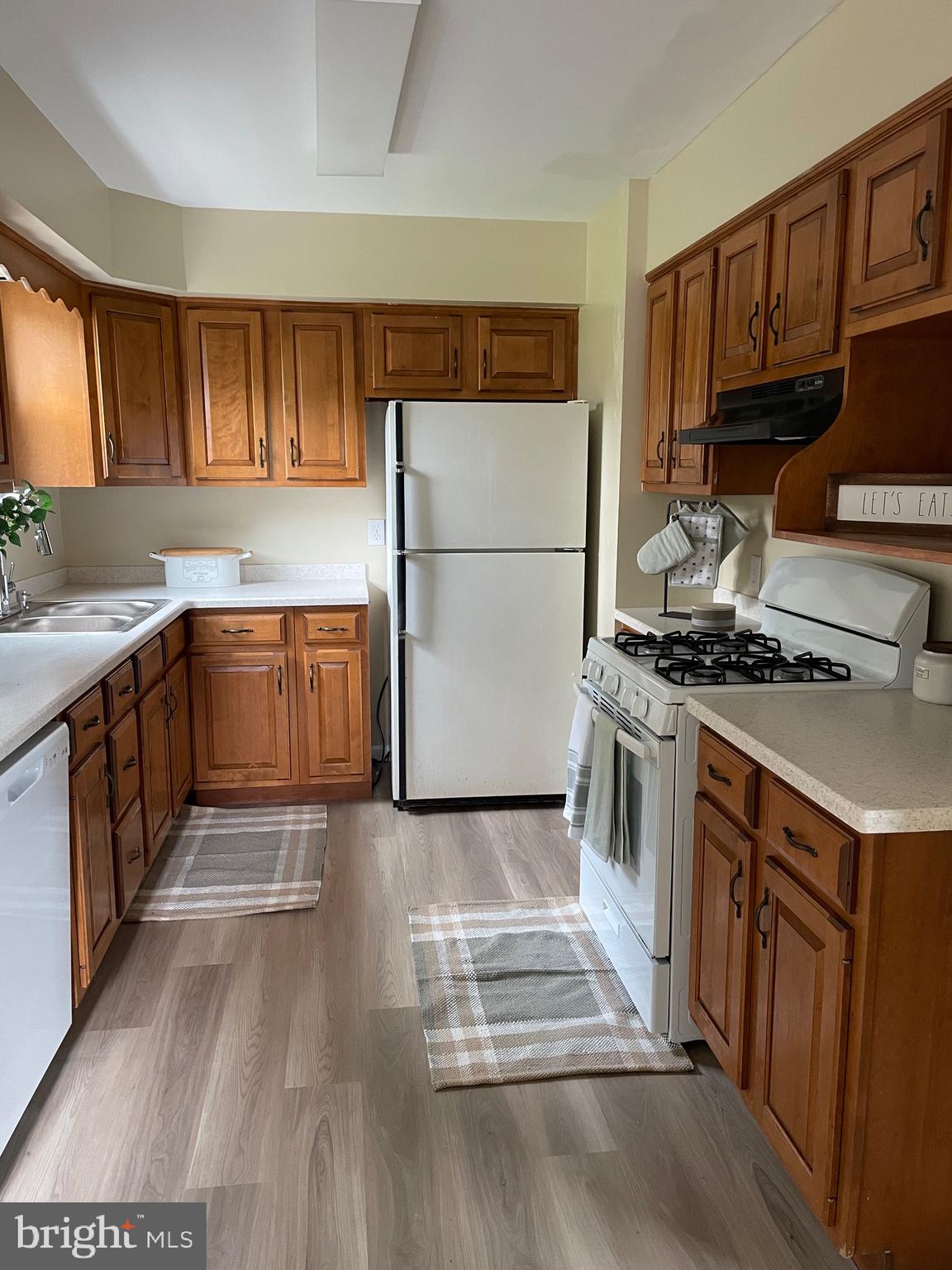 762 Erford Road Camp Hill, PA 17011 - Photo 10 of 25 a kitchen with stainless steel appliances a stove a sink and a refrigerator