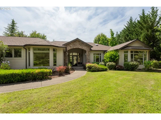 a front view of a house with garden