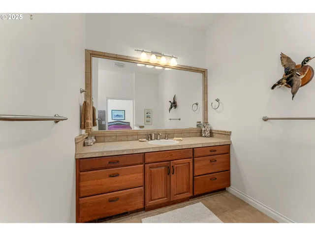 a bathroom with a double vanity sink mirror and