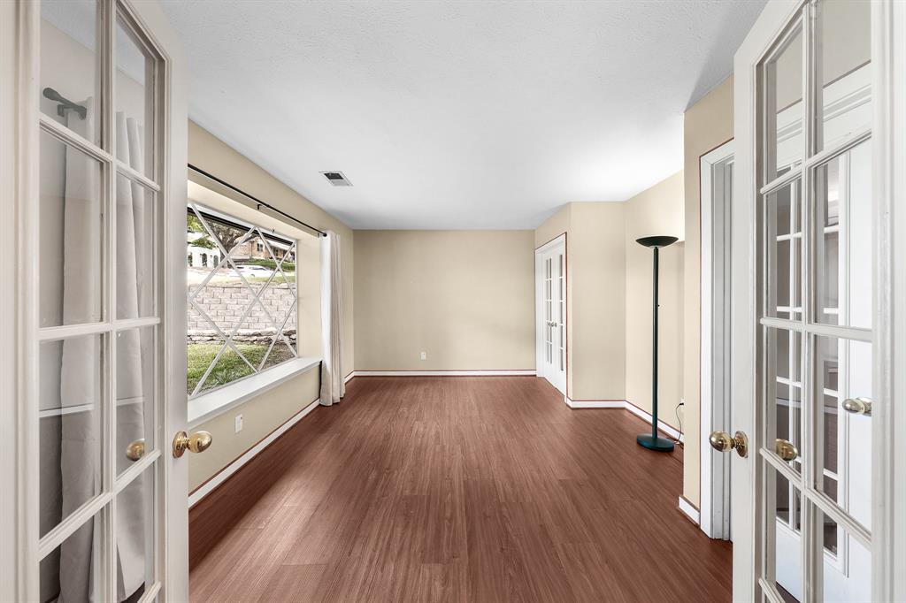 207 Summit Ridge Drive Rockwall, TX 75087 - Photo 14 of 28 a view of an entryway with wooden floors and door