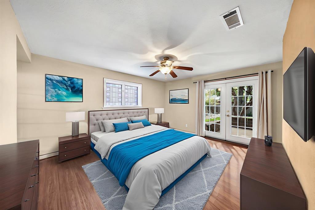 207 Summit Ridge Drive Rockwall, TX 75087 - Photo 16 of 28 a bedroom with a large bed and a large window