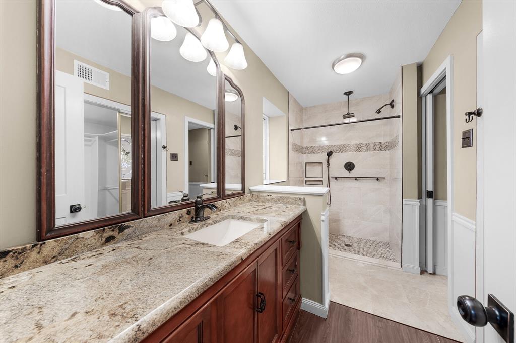 207 Summit Ridge Drive Rockwall, TX 75087 - Photo 18 of 28 a bathroom with a granite countertop sink mirror and double