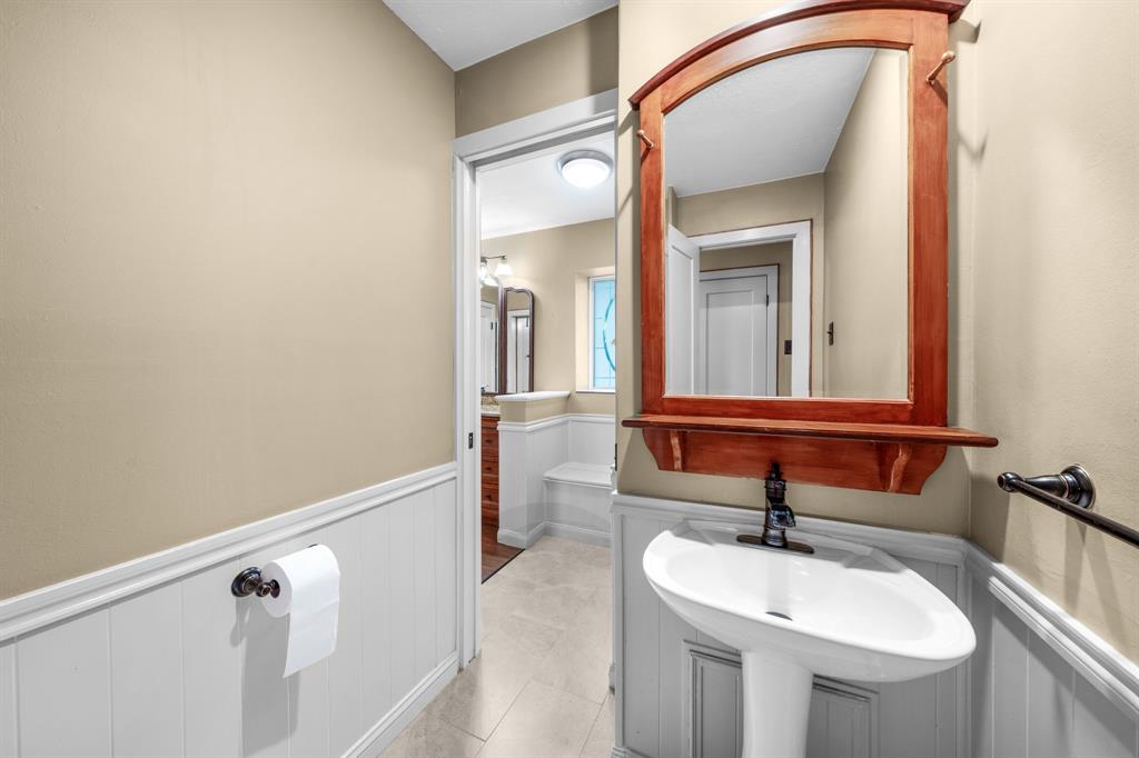 207 Summit Ridge Drive Rockwall, TX 75087 - Photo 19 of 28 a bathroom with a sink and a mirror
