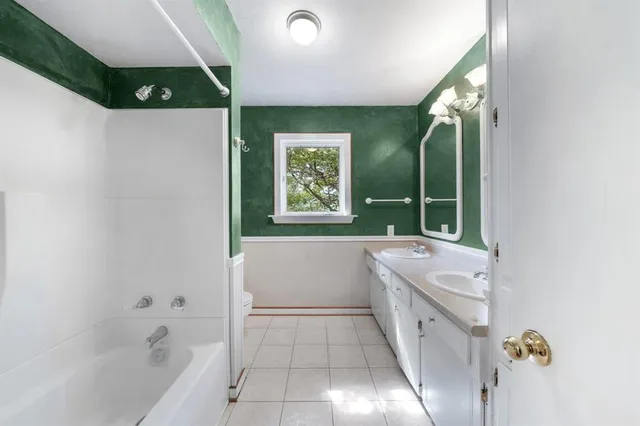 a bathroom with a sink and mirror