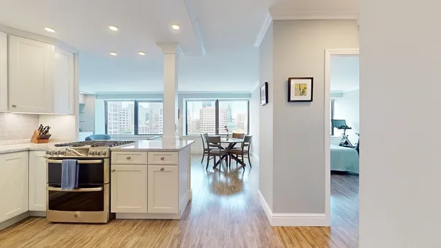 a kitchen with a table and chairs