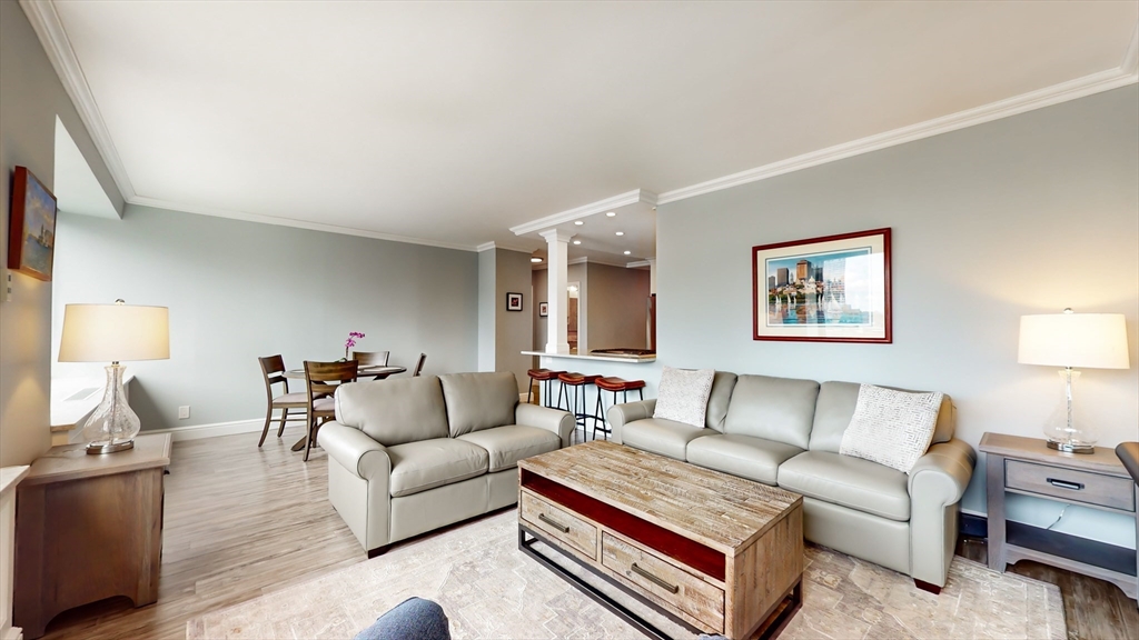 65 East India Row, Unit 24H Boston, MA 02110 - Photo 9 of 27 a living room with furniture and a couch
