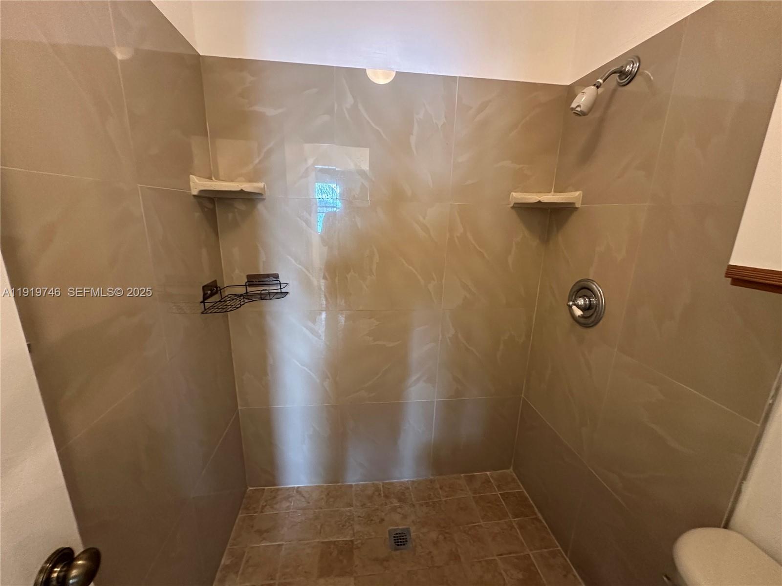 1024 South Independence Drive, Unit 1024A Homestead, FL 33034 - Photo 14 of 26 a bathroom with a shower