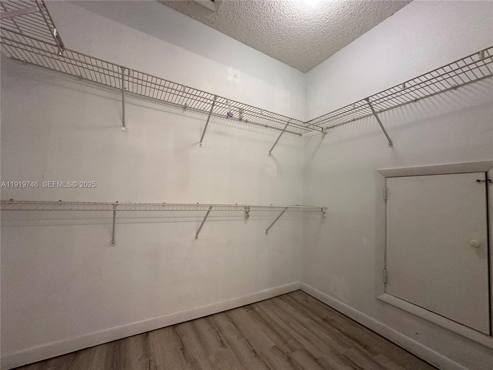 1024 South Independence Drive, Unit 1024A Homestead, FL 33034 - Photo 16 of 26 a view of a room with racks on the wall
