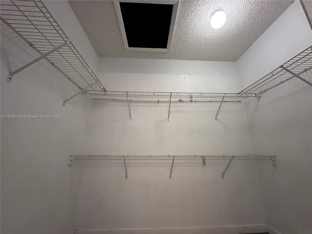 a view of a room with racks on the wall