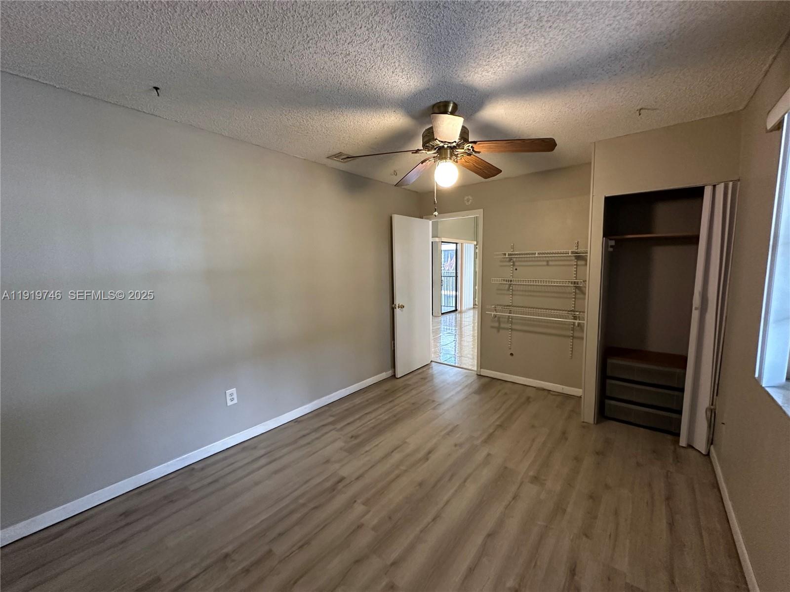 1024 South Independence Drive, Unit 1024A Homestead, FL 33034 - Photo 18 of 26 wooden floor in an empty room with a window