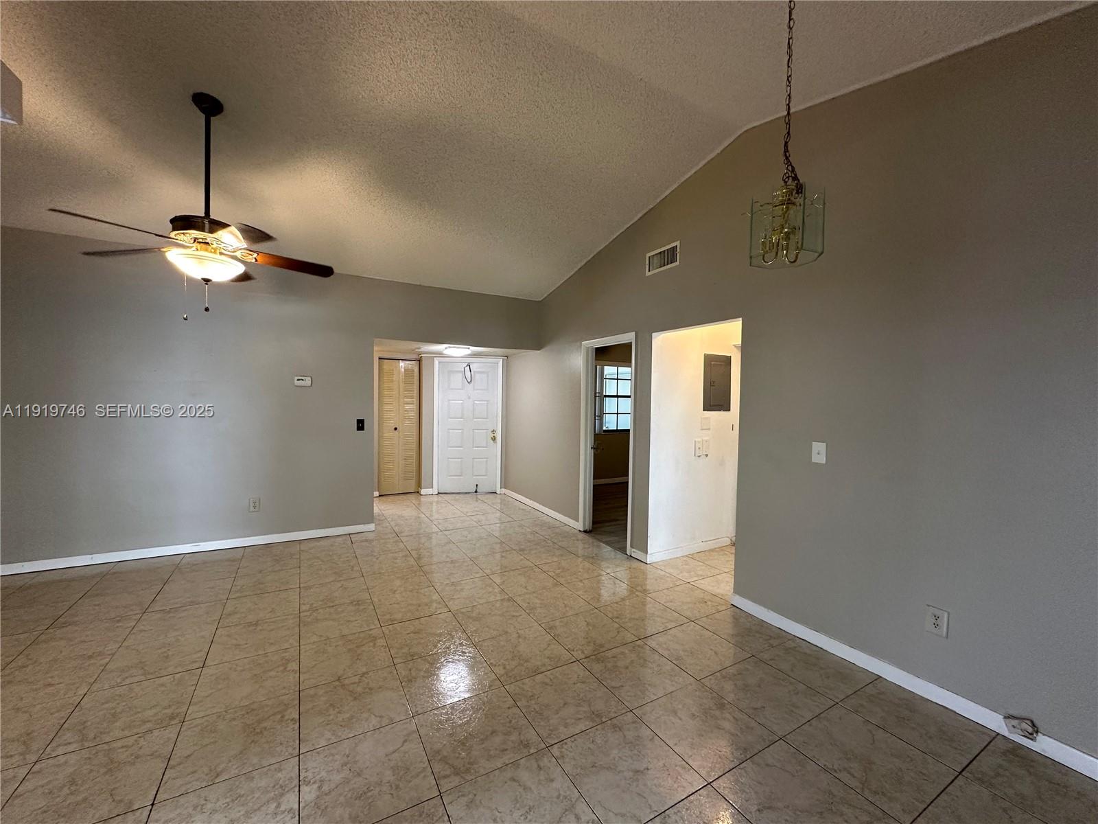 1024 South Independence Drive, Unit 1024A Homestead, FL 33034 - Photo 3 of 26 a view of a livingroom with a chandelier