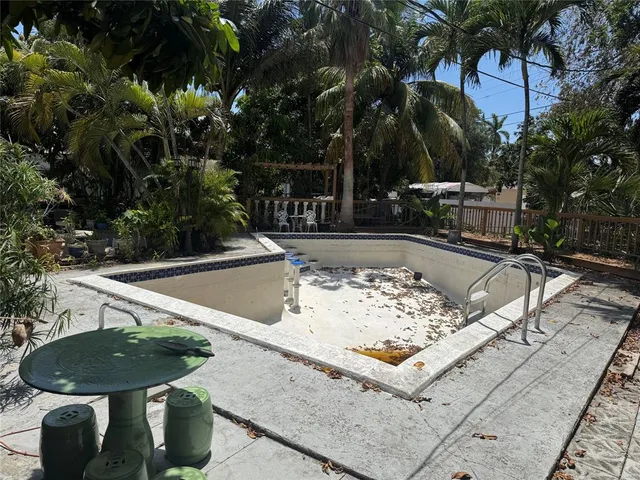 a view of a sink and table in the backyard