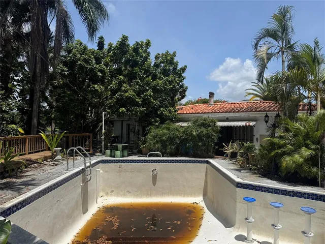 a view of a swimming pool with a patio