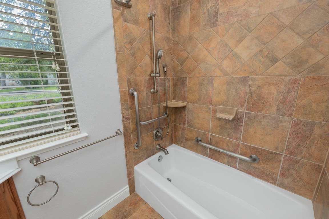 1001 Fort Davis Street Georgetown, TX 78633 - Photo 33 of 40 a bathroom with a bathtub and a shower