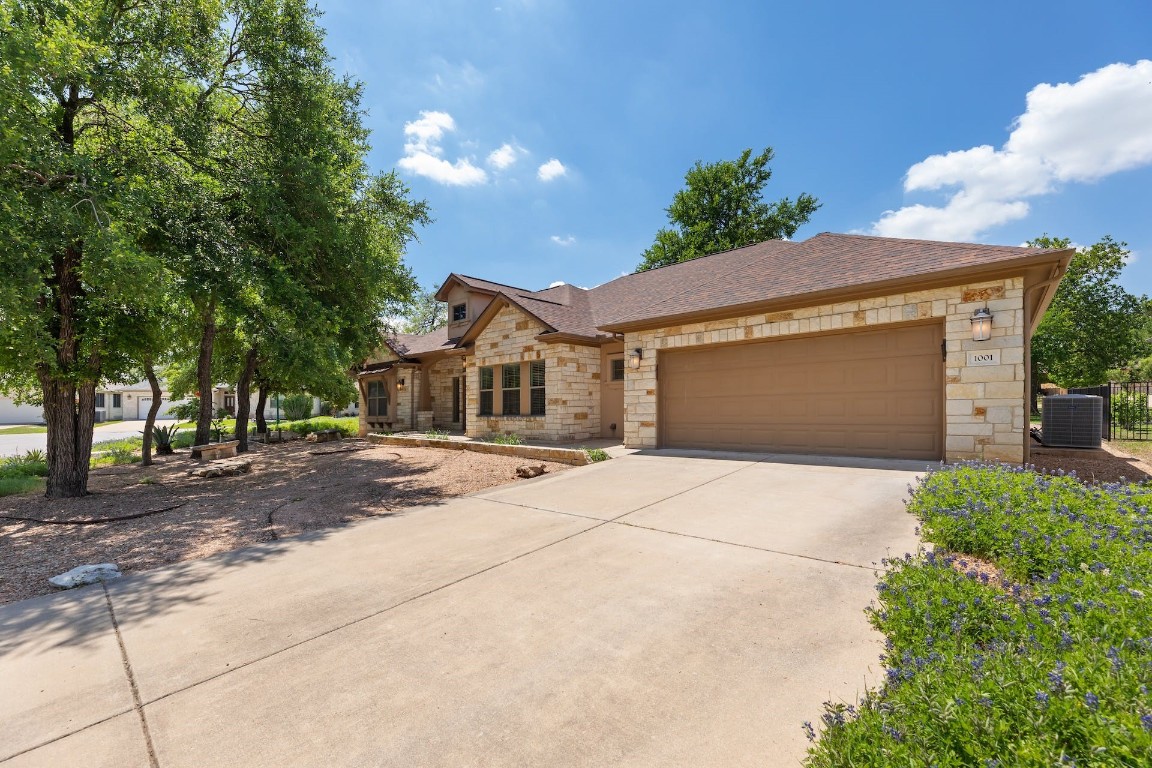 1001 Fort Davis Street Georgetown, TX 78633 - Photo 4 of 40 a front view of a house with a yard and garage
