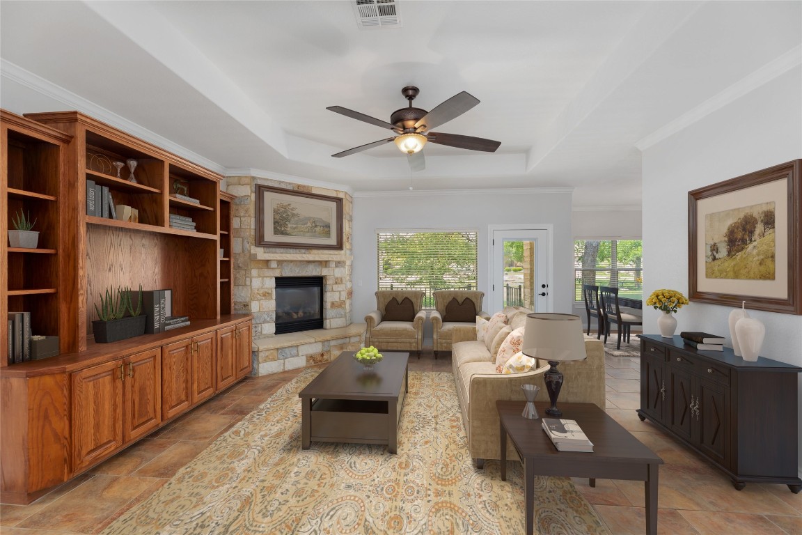 1001 Fort Davis Street Georgetown, TX 78633 - Photo 6 of 40 a living room with furniture a flat screen tv and a fireplace