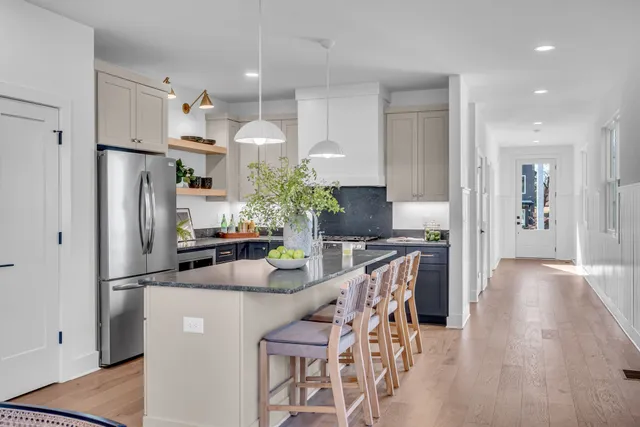 a living room with furniture potted plant and a fireplace