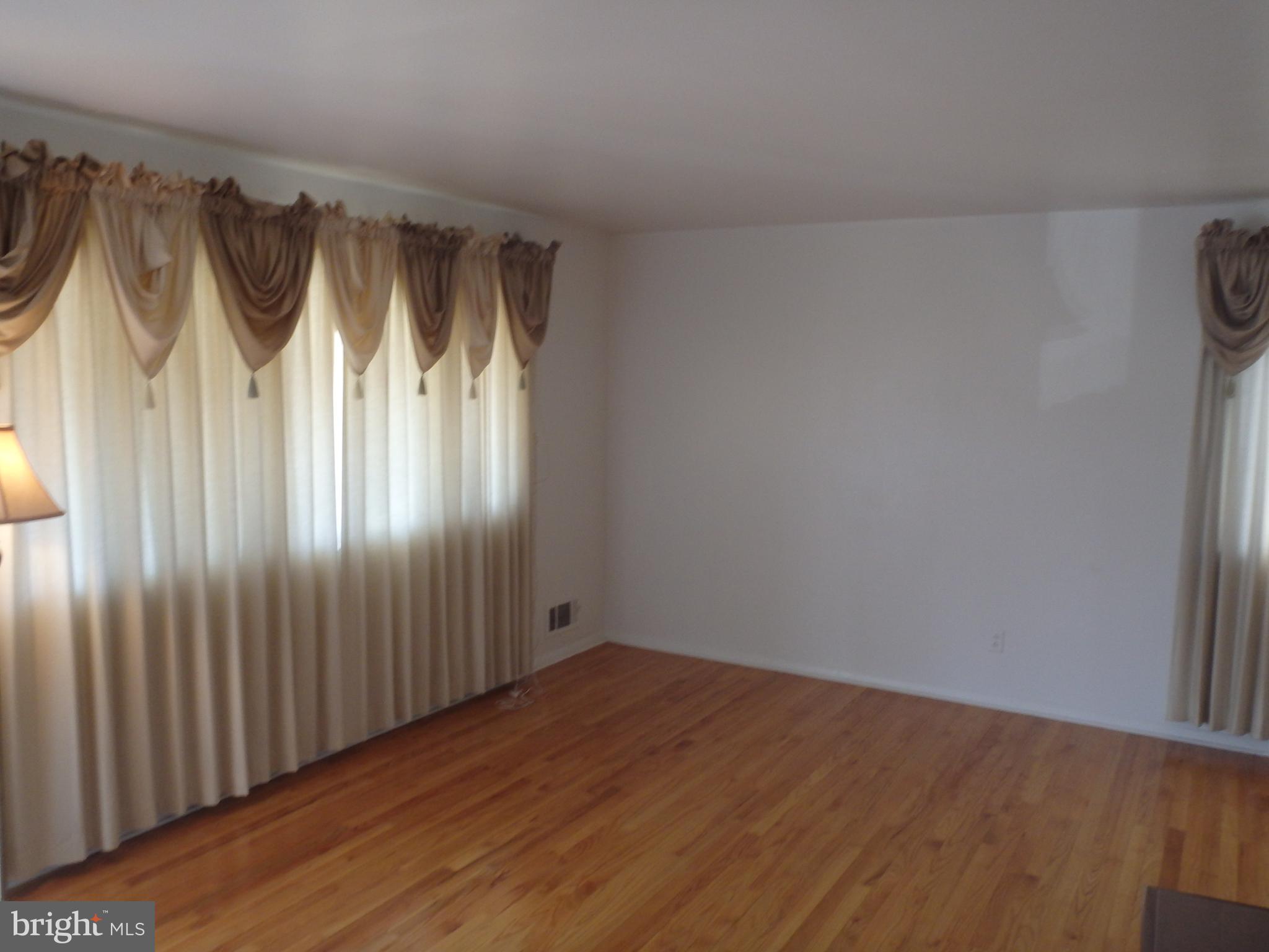 8618 Delegge Road Rosedale, MD 21237 - Photo 5 of 21 LIVING ROOOM - HARDWOOD FLOORS