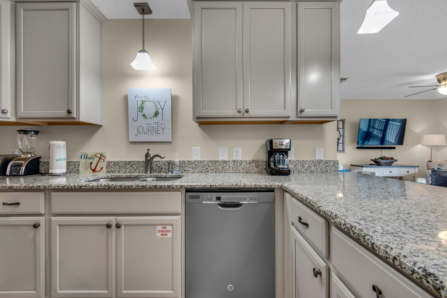 3799 East County Highway 30A, Unit E11 Santa Rosa Beach, FL 32459 - Photo 11 of 31 a kitchen with granite countertop stainless steel appliances sink and cabinets