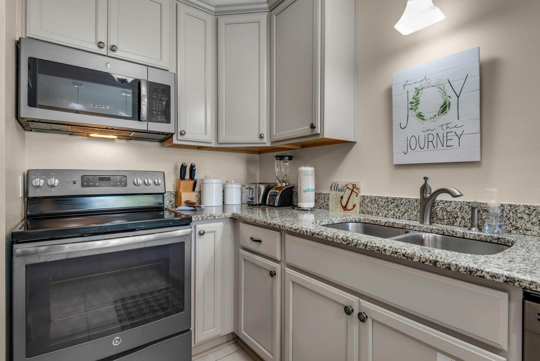 3799 East County Highway 30A, Unit E11 Santa Rosa Beach, FL 32459 - Photo 12 of 31 a kitchen with granite countertop cabinets stainless steel appliances and a sink