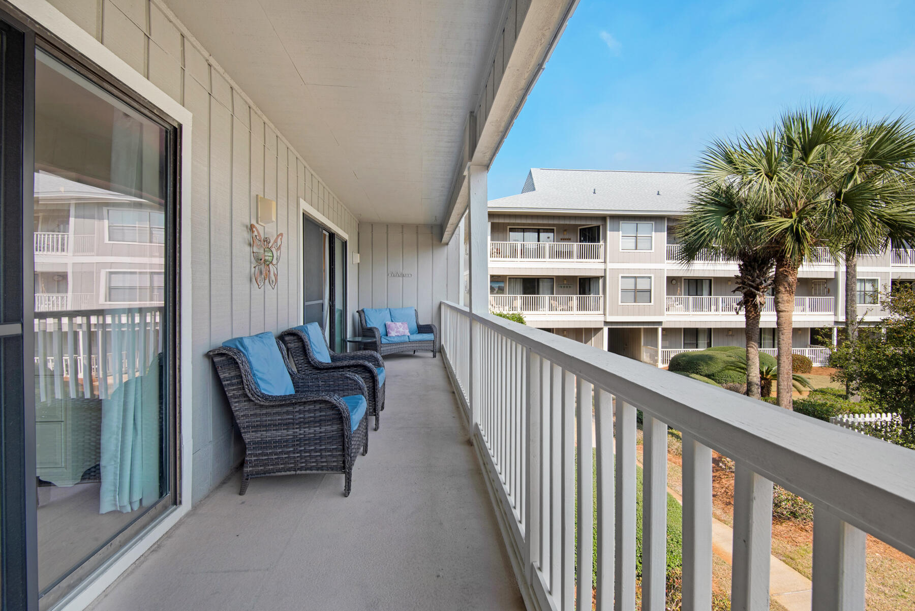 3799 East County Highway 30A, Unit E11 Santa Rosa Beach, FL 32459 - Photo 15 of 31 a view of a balcony with chairs and wooden fence