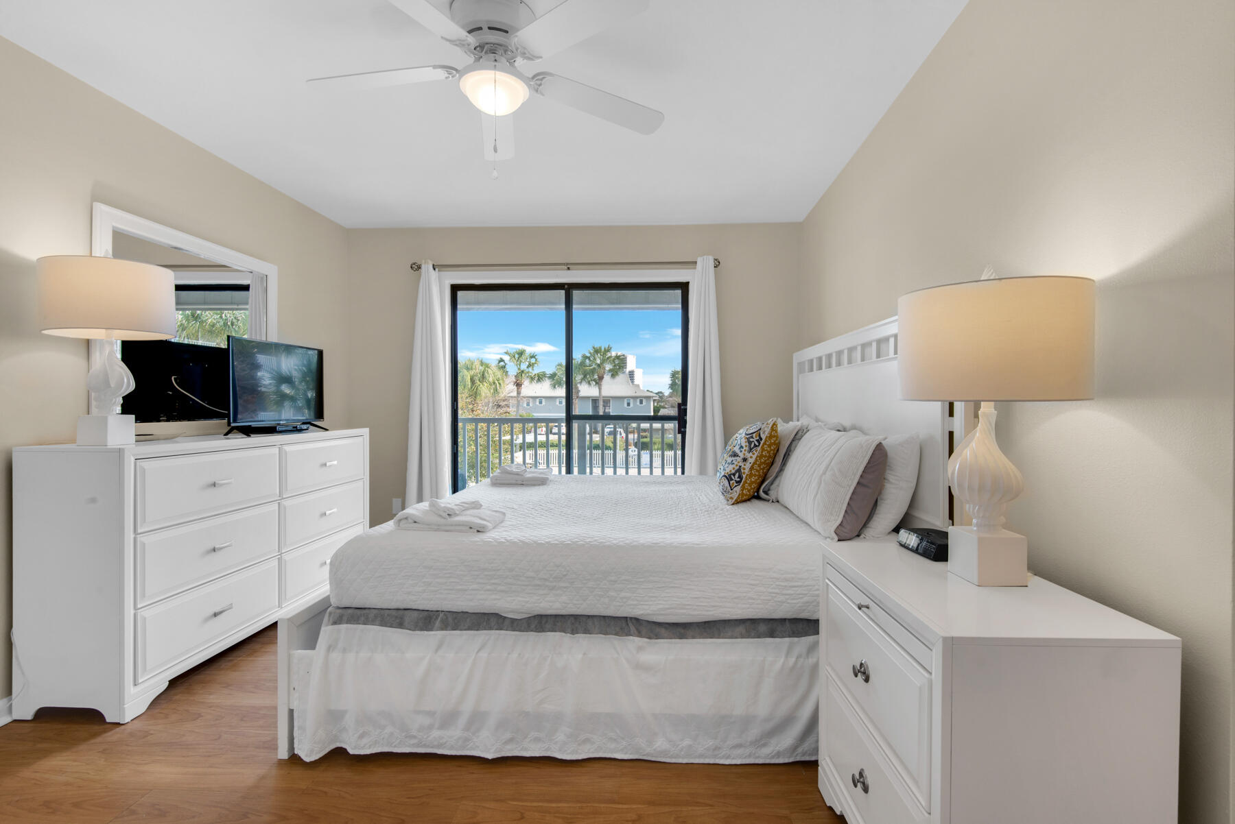 3799 East County Highway 30A, Unit E11 Santa Rosa Beach, FL 32459 - Photo 19 of 31 a bedroom with a bed and a flat screen tv