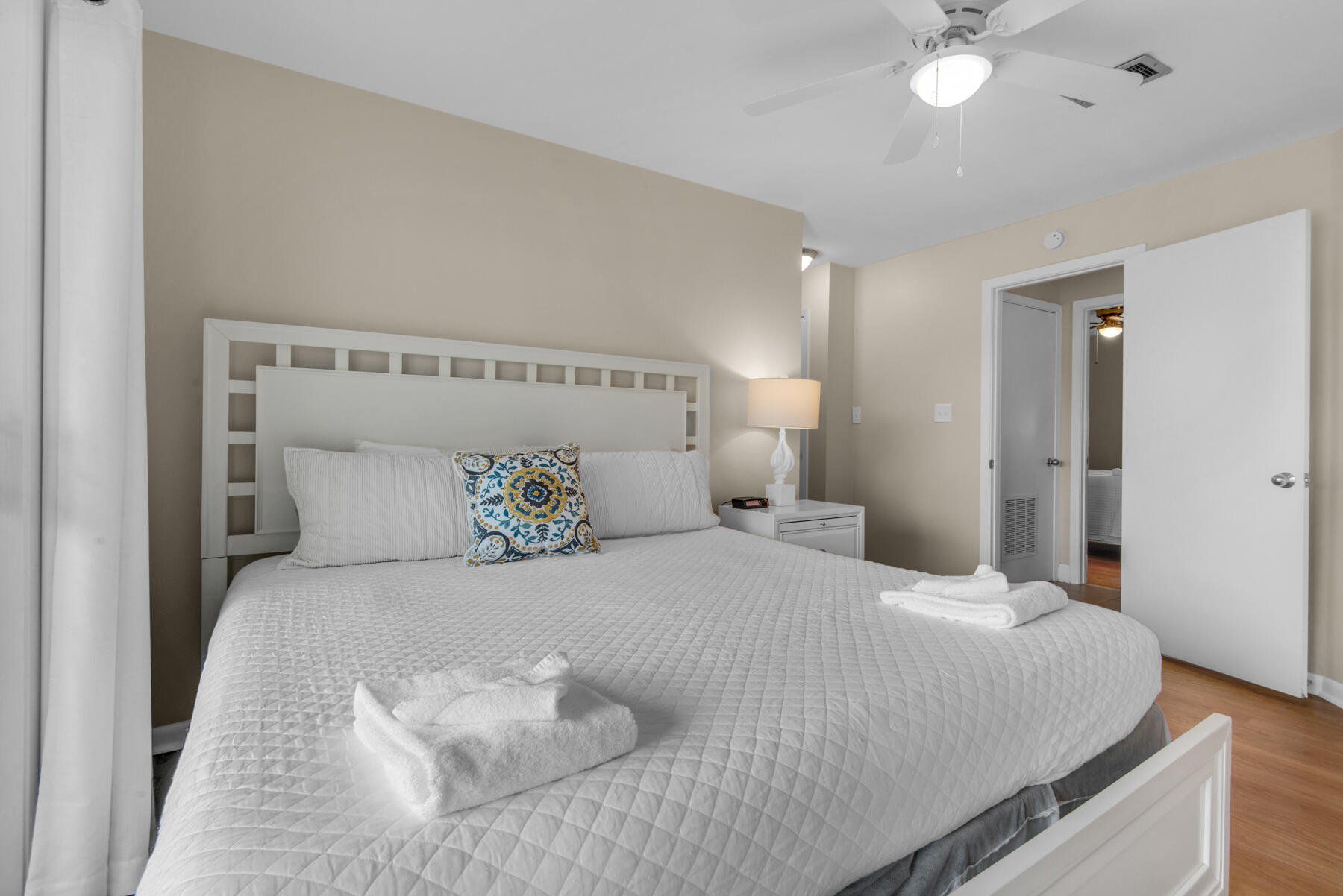 3799 East County Highway 30A, Unit E11 Santa Rosa Beach, FL 32459 - Photo 21 of 31 a bedroom with a bed and a ceiling fan