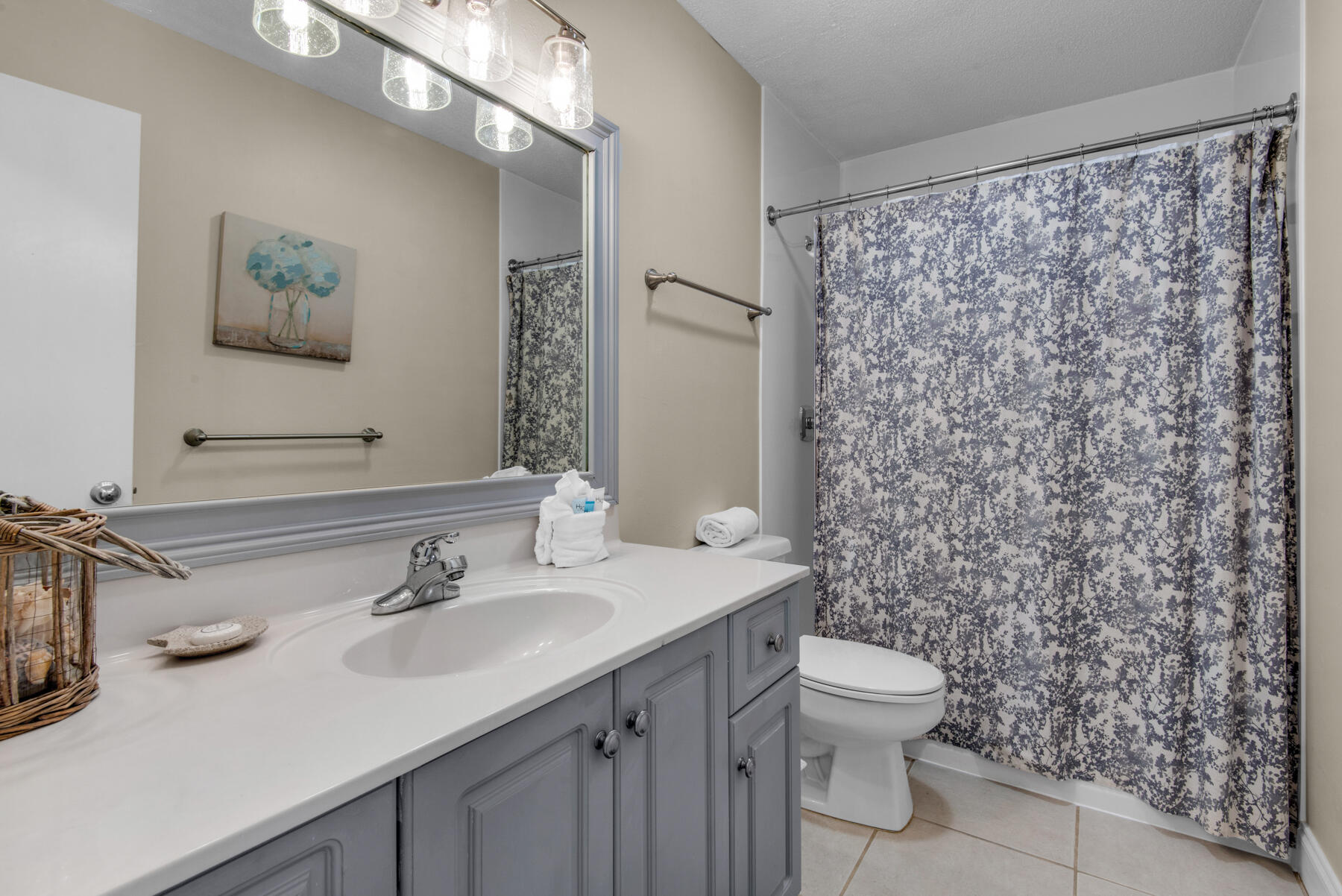 3799 East County Highway 30A, Unit E11 Santa Rosa Beach, FL 32459 - Photo 22 of 31 a bathroom with a sink toilet and mirror