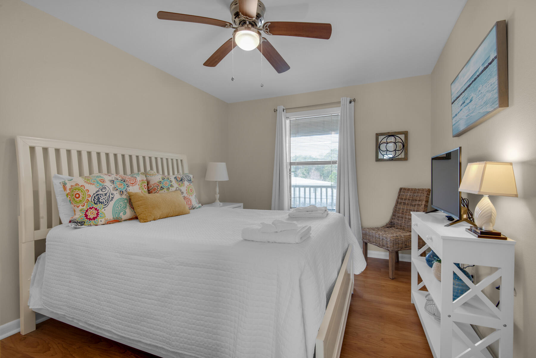 3799 East County Highway 30A, Unit E11 Santa Rosa Beach, FL 32459 - Photo 23 of 31 a bedroom with a bed and wooden floor