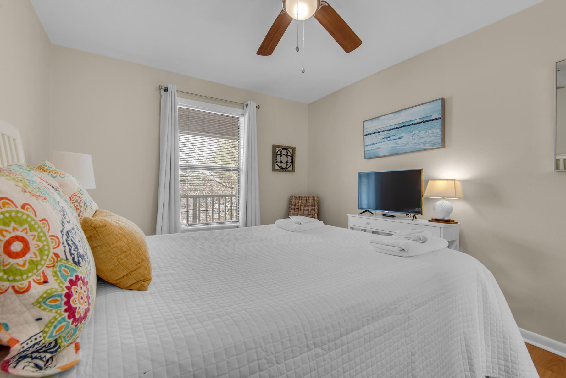 3799 East County Highway 30A, Unit E11 Santa Rosa Beach, FL 32459 - Photo 24 of 31 a bedroom with a bed and a flat screen tv