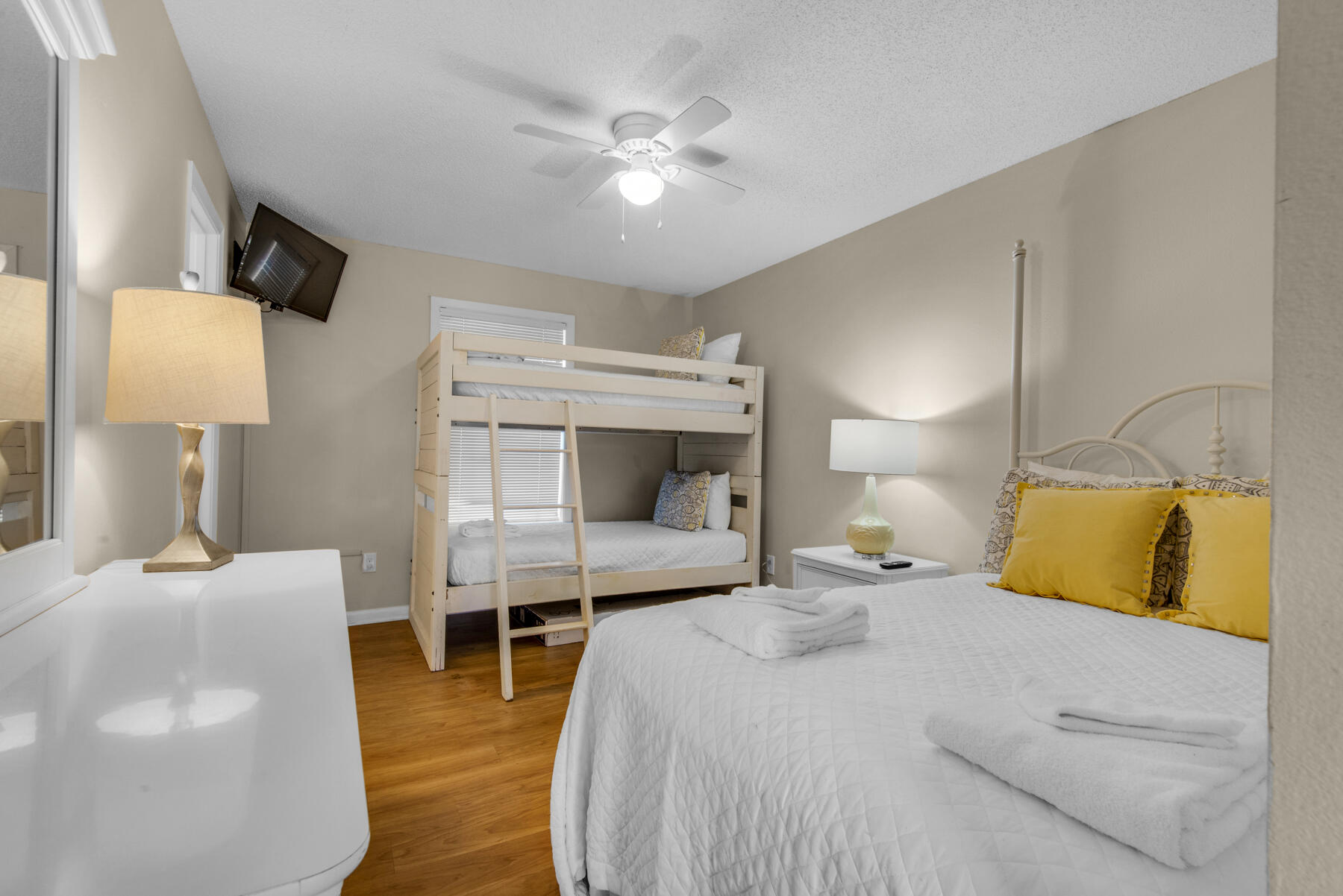 3799 East County Highway 30A, Unit E11 Santa Rosa Beach, FL 32459 - Photo 26 of 31 a bedroom with a bed and a chandelier
