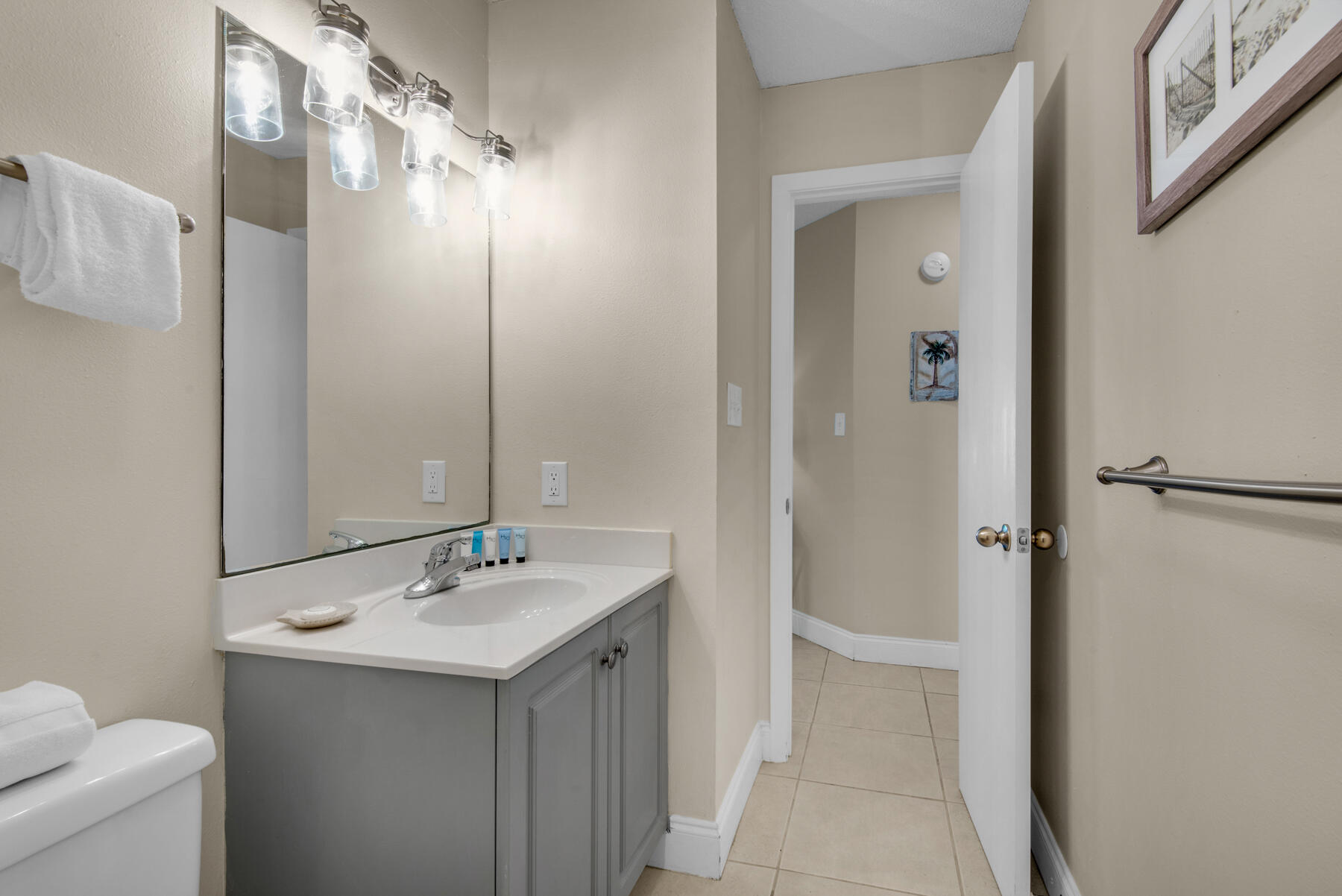 3799 East County Highway 30A, Unit E11 Santa Rosa Beach, FL 32459 - Photo 31 of 31 a bathroom with a sink and mirror