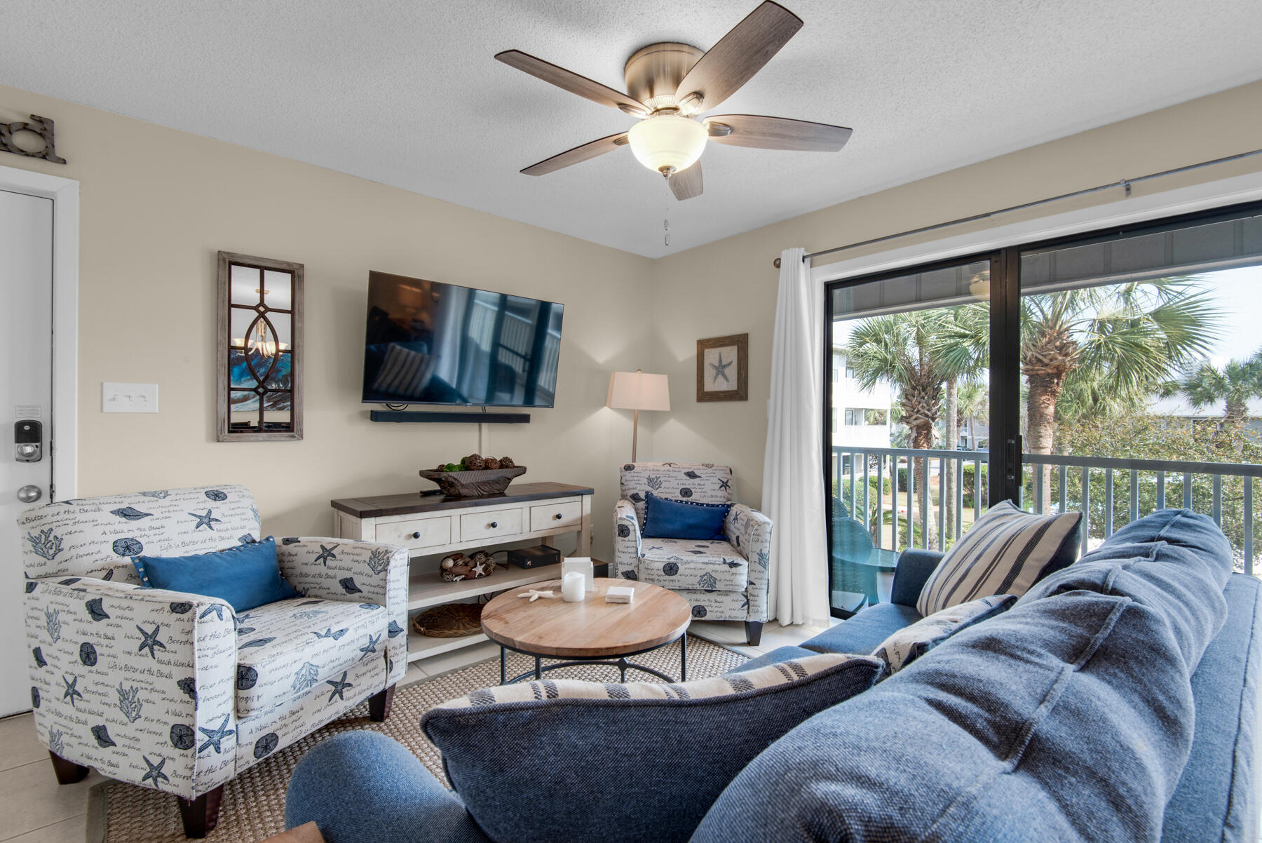 3799 East County Highway 30A, Unit E11 Santa Rosa Beach, FL 32459 - Photo 5 of 31 a living room with furniture and a flat screen tv