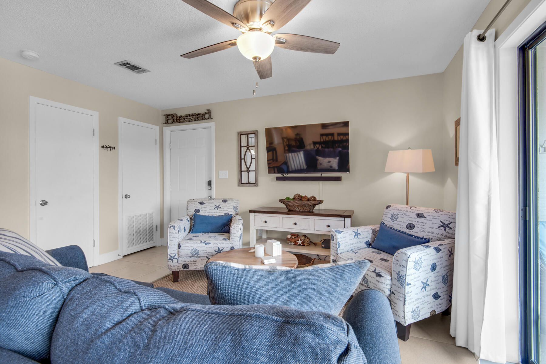 3799 East County Highway 30A, Unit E11 Santa Rosa Beach, FL 32459 - Photo 6 of 31 a living room with furniture and a flat screen tv