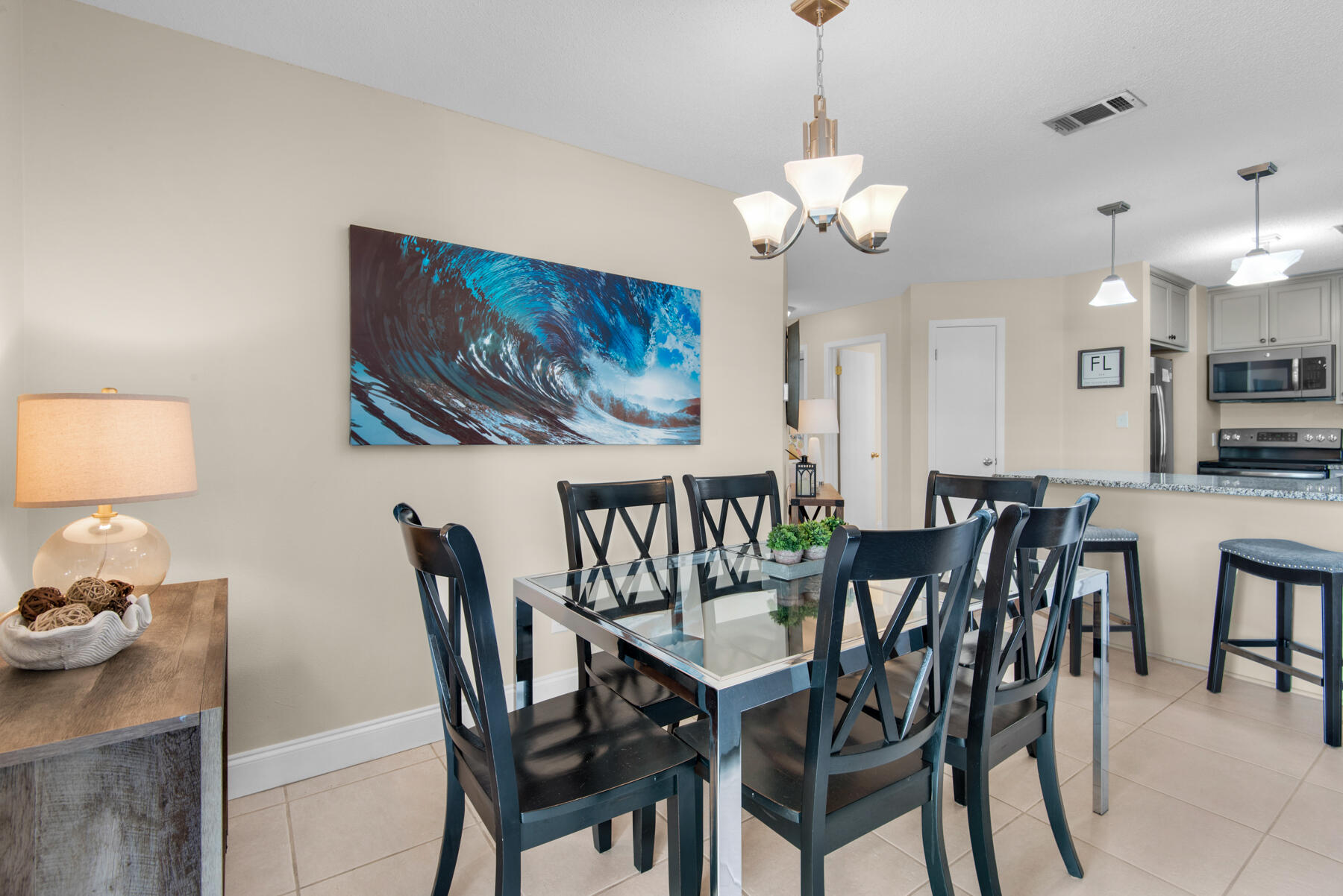 3799 East County Highway 30A, Unit E11 Santa Rosa Beach, FL 32459 - Photo 7 of 31 a view of a dining room with furniture and chandelier