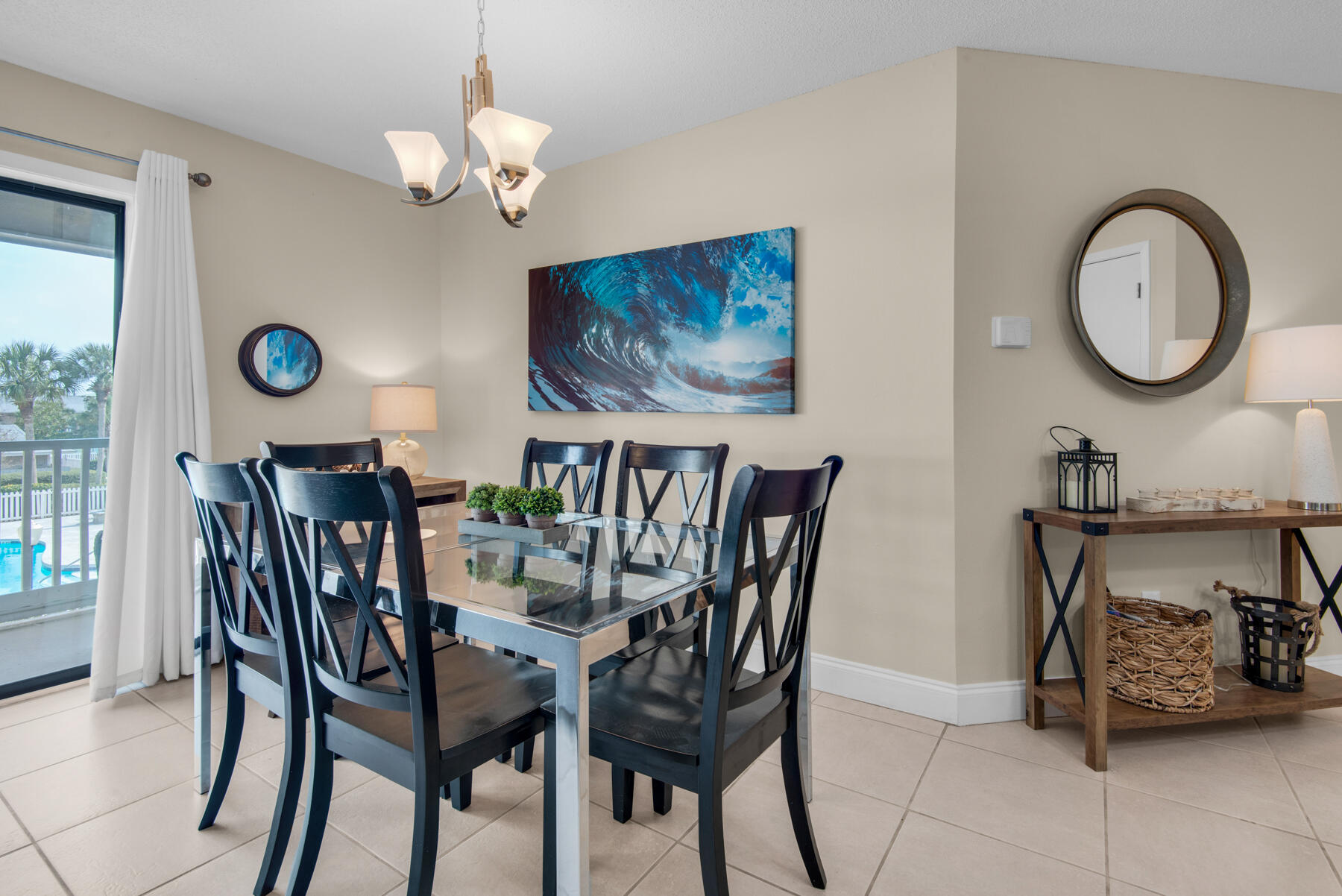 3799 East County Highway 30A, Unit E11 Santa Rosa Beach, FL 32459 - Photo 8 of 31 a view of a dining room with furniture and a chandelier