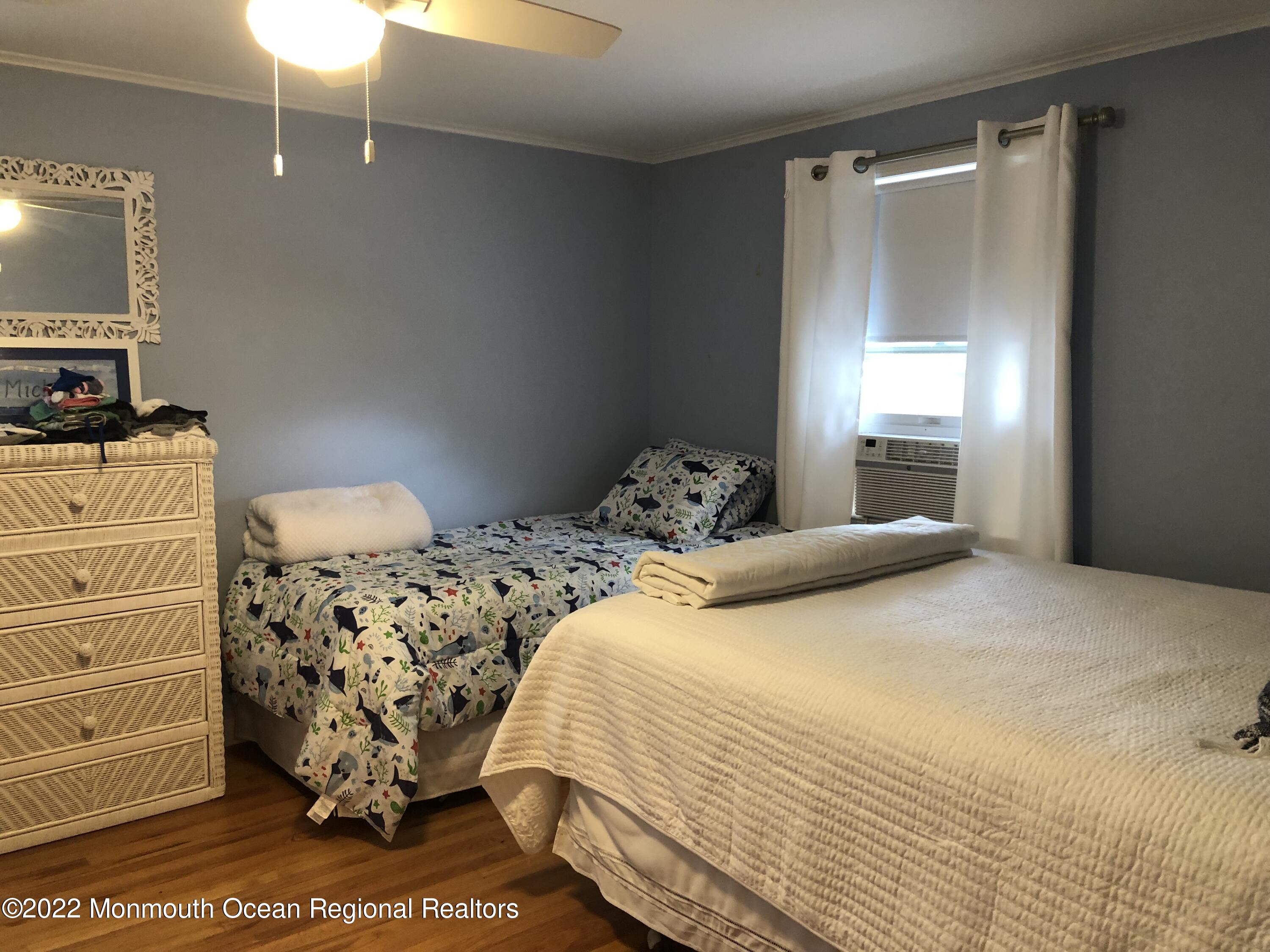 419 Jersey Avenue Spring Lake, NJ 07762 - Photo 23 of 32 a bedroom with a bed and a window