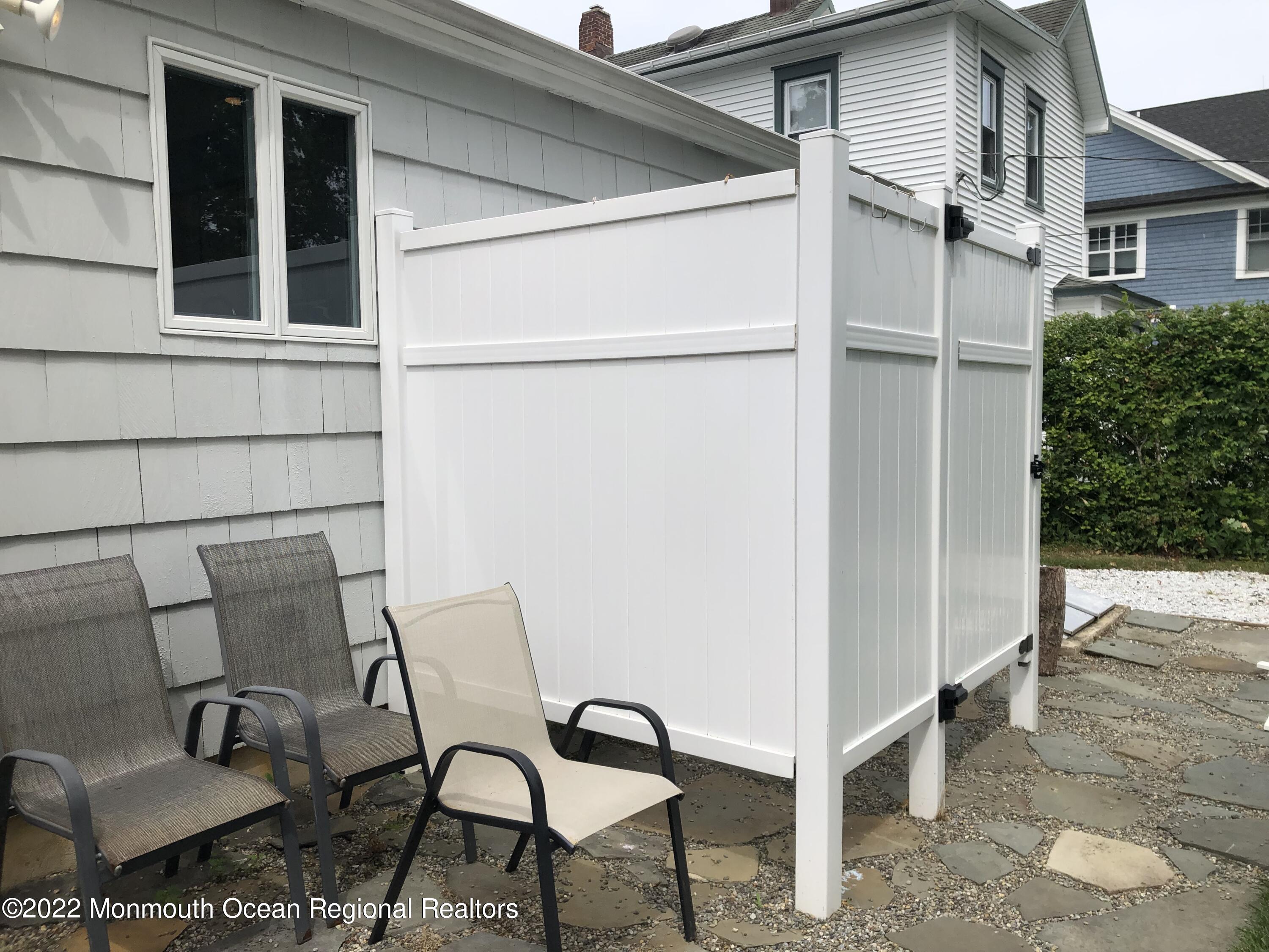 419 Jersey Avenue Spring Lake, NJ 07762 - Photo 27 of 32 a view of a patio with chair and table
