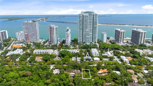 a view of a large building with a flower garden